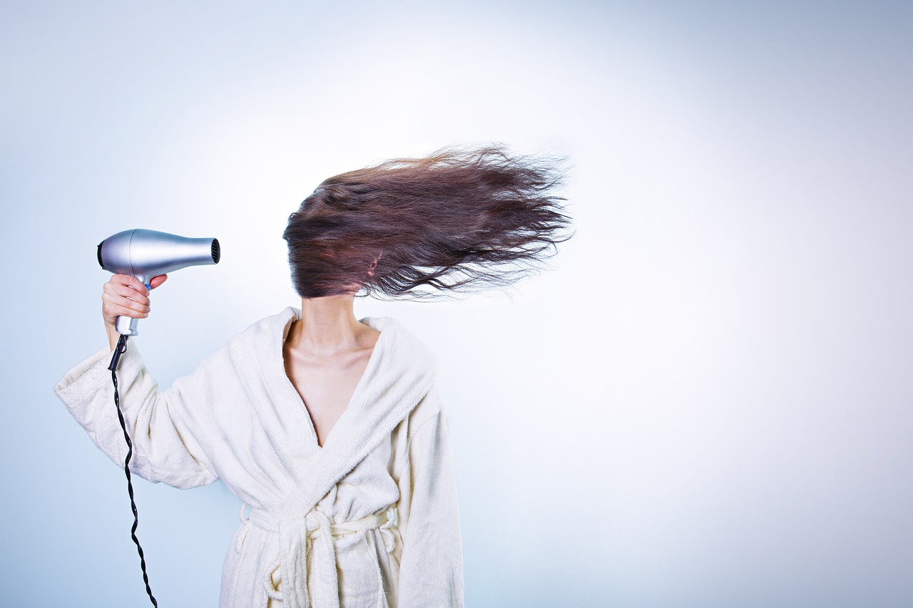 Long brunette hair being blow-dried